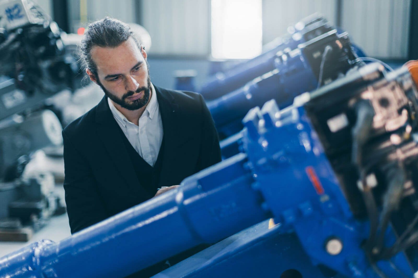 Businessman Manager In Suit Working In Machinery